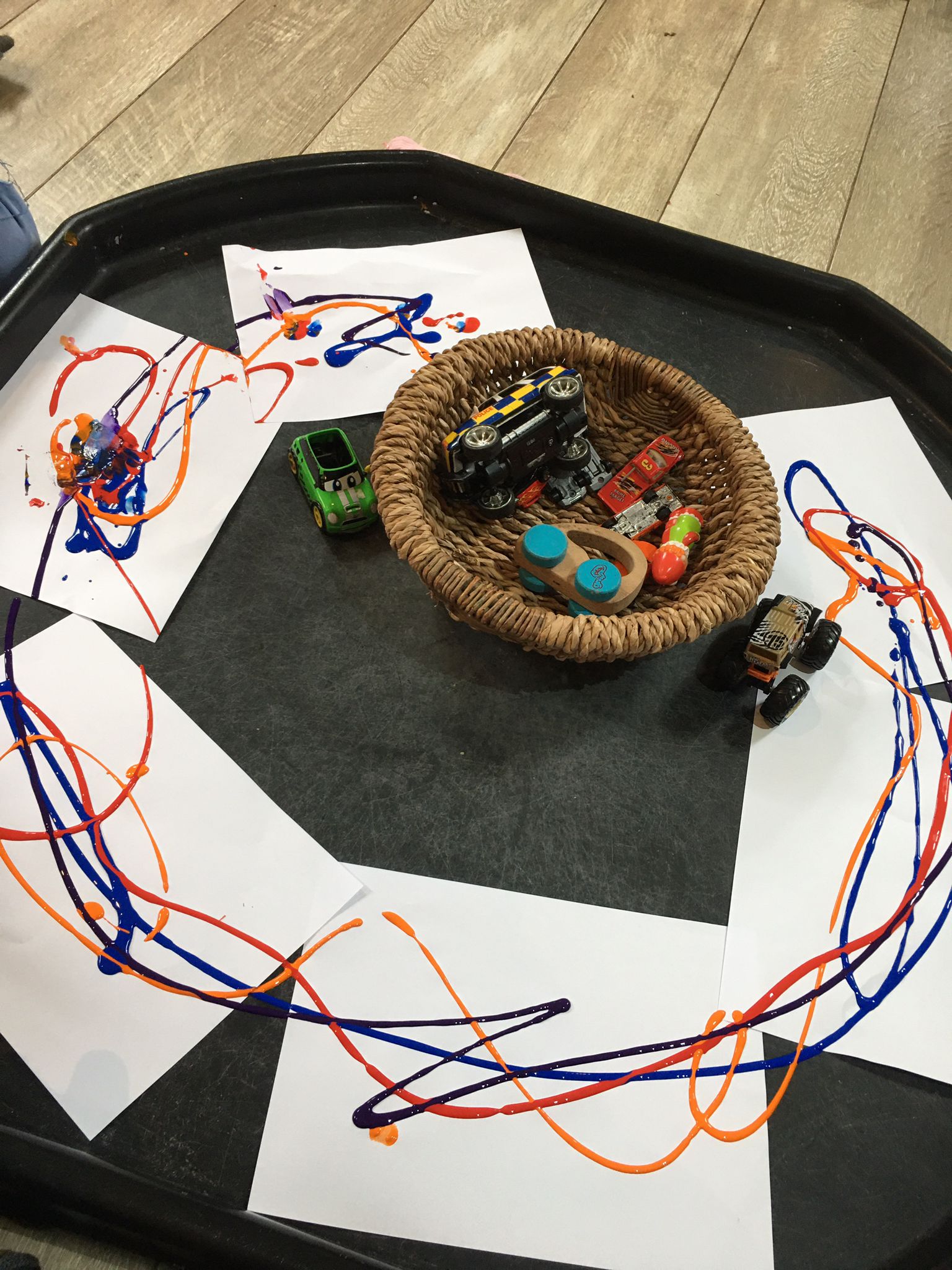 Paint artwork surrounding a basket of toys